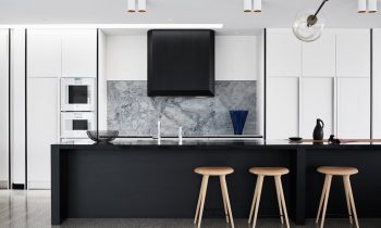 black-cabinetry-grey-marble-kitchen